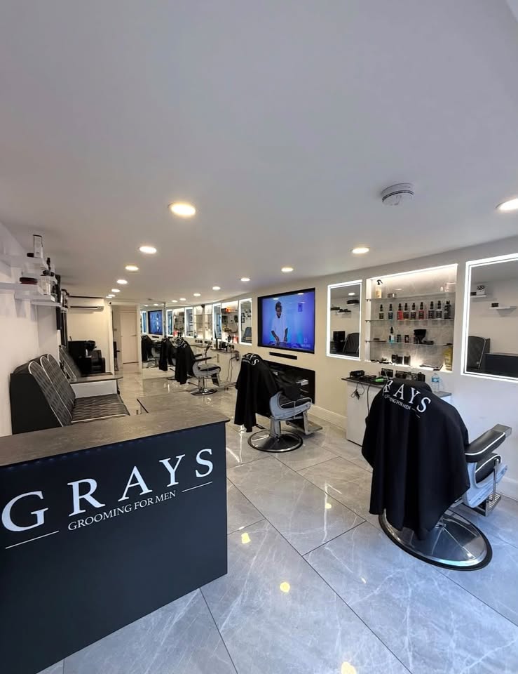 Inside Grays: leather barber chairs, illuminated mirrors and a welcoming space